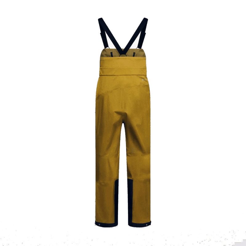 Pantaloni da montagna gialli con bretelle, abbigliamento outdoor tecnico e resistente.